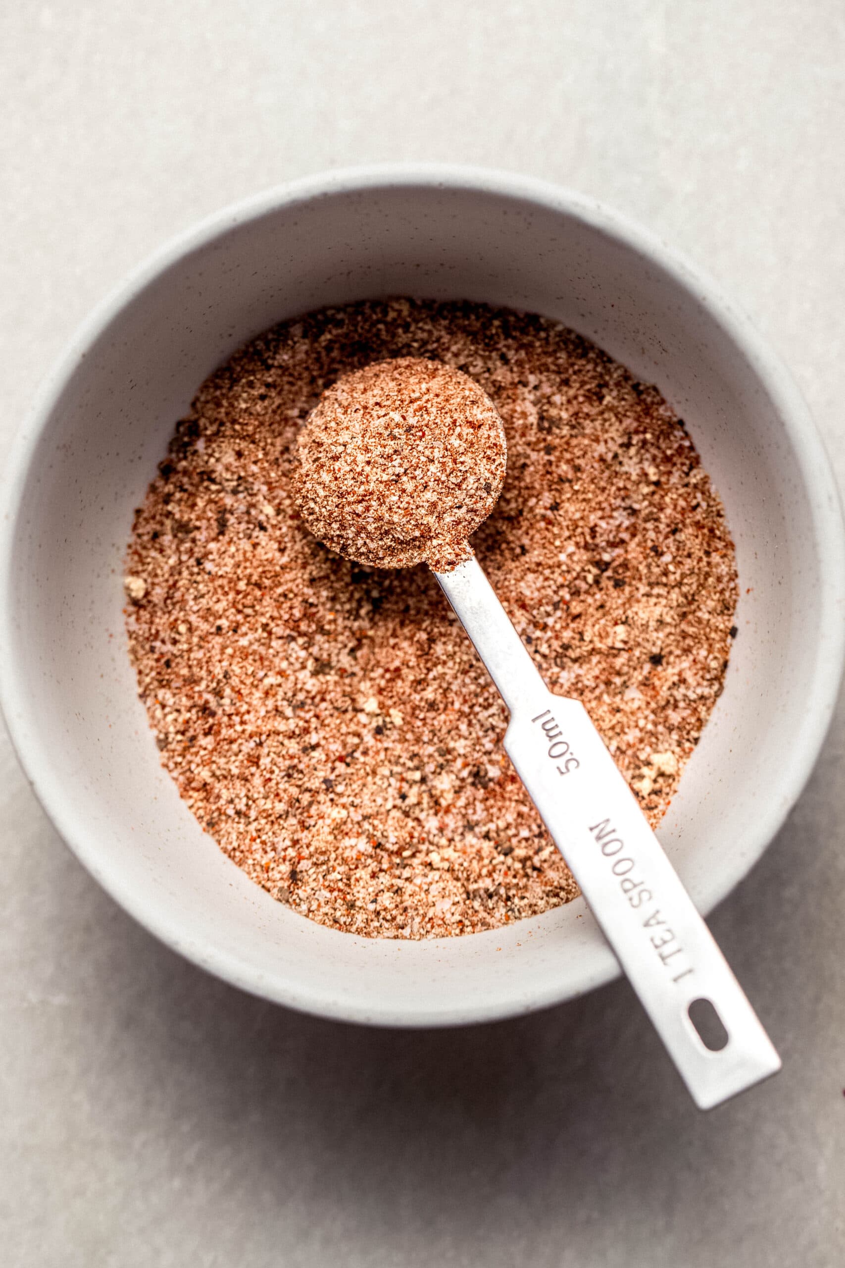 Chicken seasonings whisked together in small bowl.