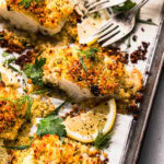 Baked panko cod pieces on baking sheet.