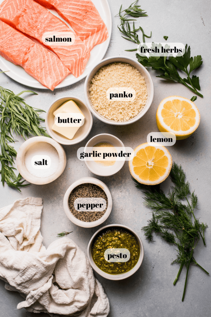 Ingredients for pesto salmon labeled on counter. 