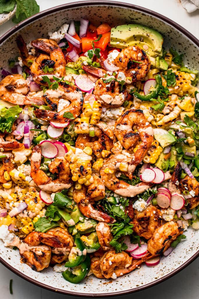 Overhead close up of assembled elote salad in bowl.