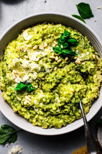 Overhead shot of pesto risotto in bowl.