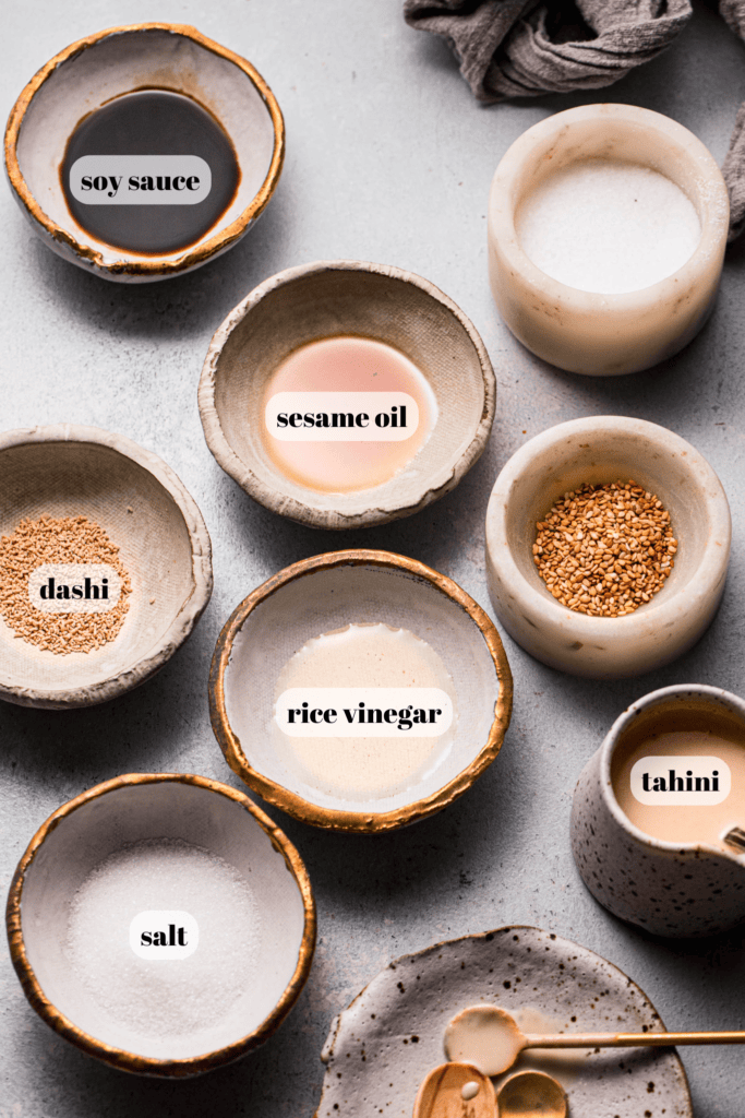 Ingredients for sesame sauce labeled on counter.