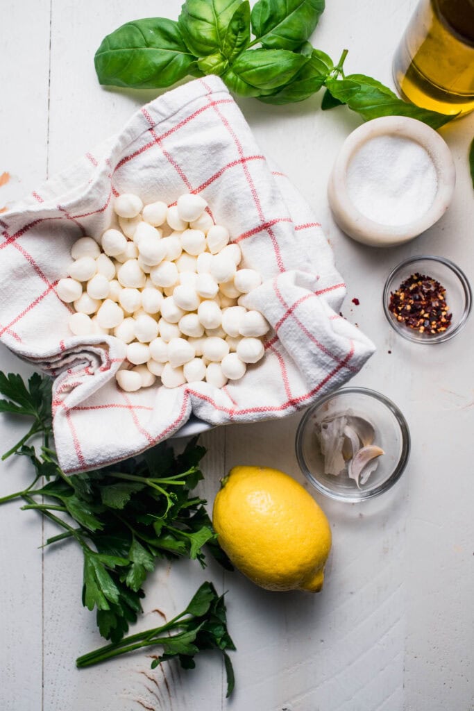 Mozzarella balls being dried. 