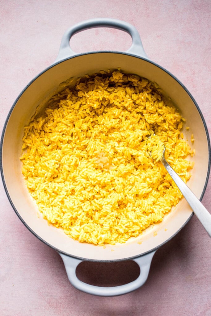 Fluffed greek lemon rice in pot ready to serve.