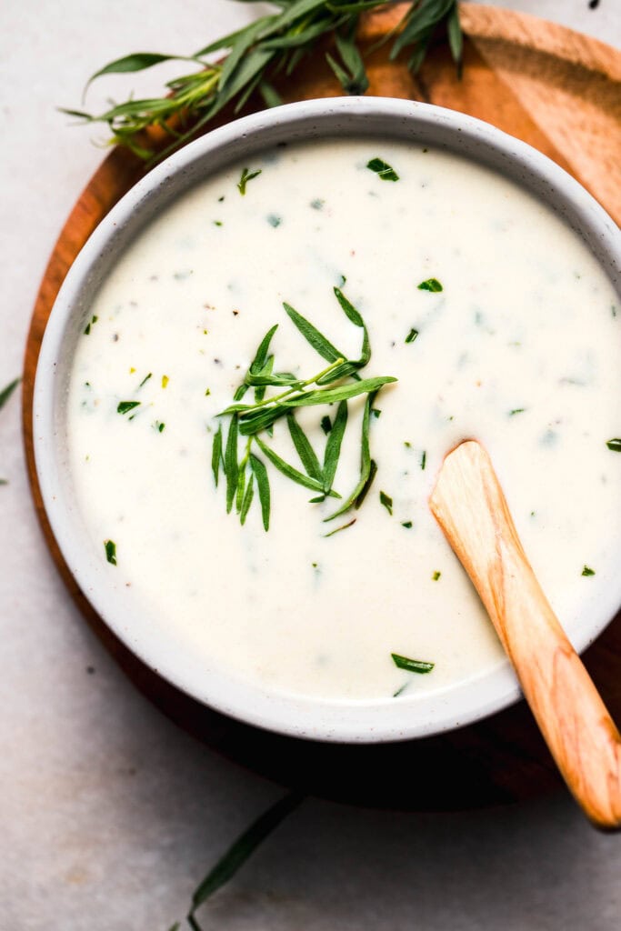 Overhead close up of bowl of tarragon cream sauce.