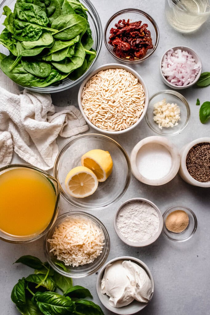 Ingredients for sundried tomato orzo with chicken on counter. 