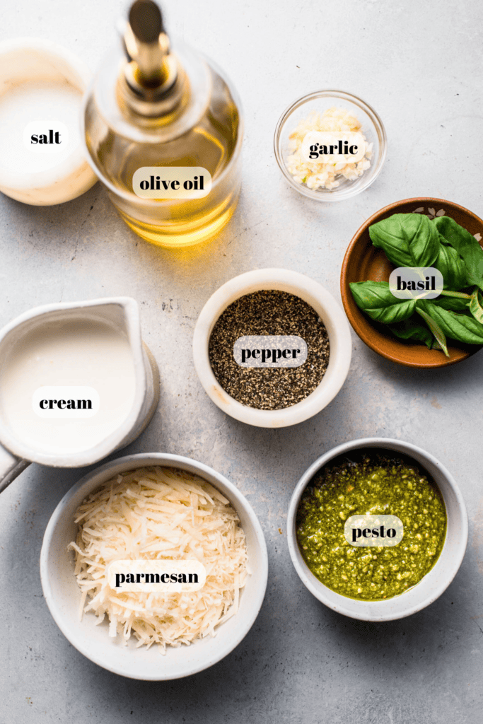 Pesto cream sauce ingredients labeled on counter.