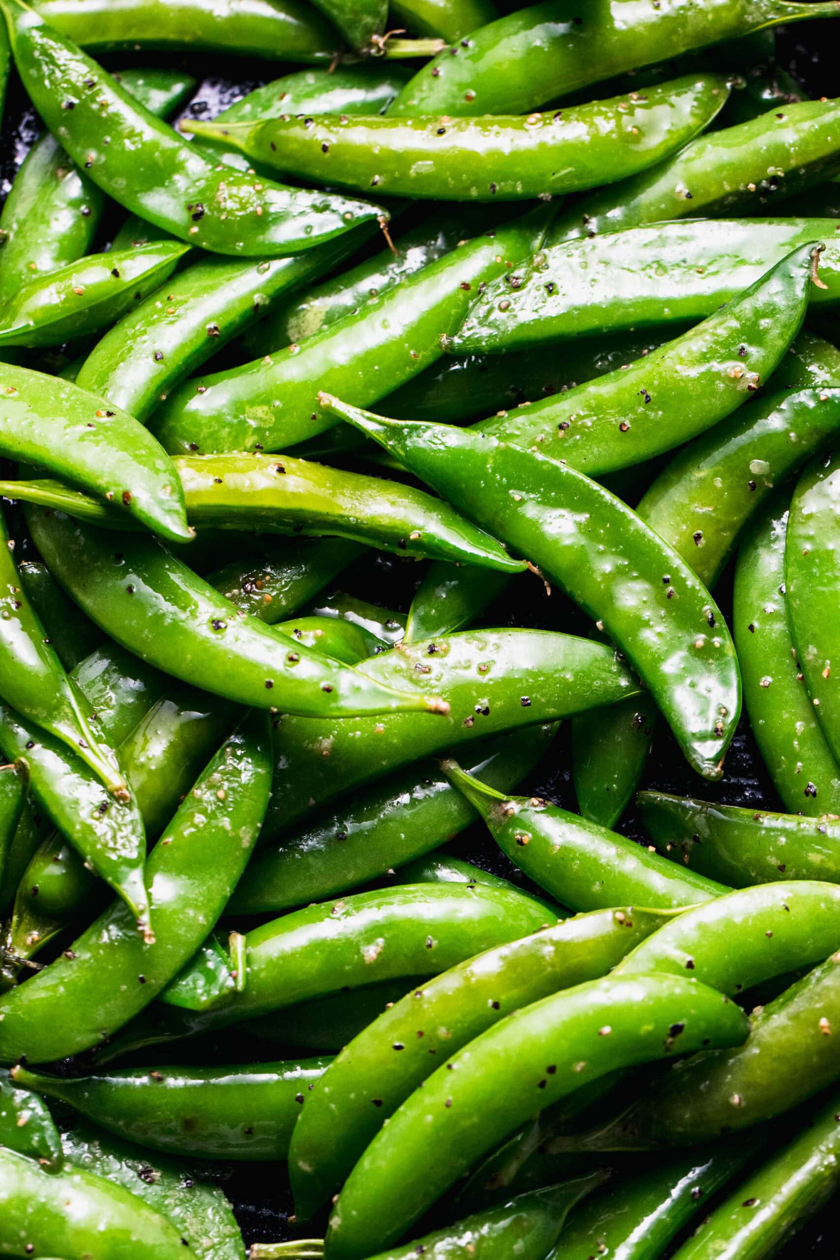 Overhead close up of sauteed sugar snap peas.