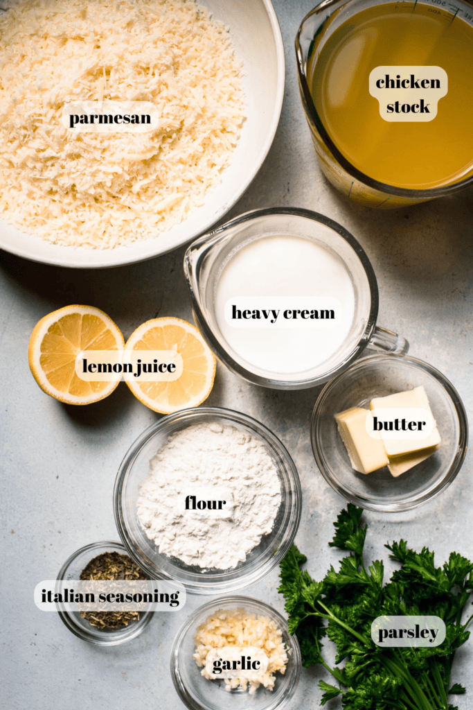 Ingredients for parmesan cream sauce labeled on counter. 