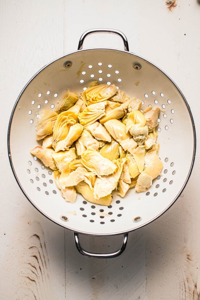 Artichoke hearts in collander.