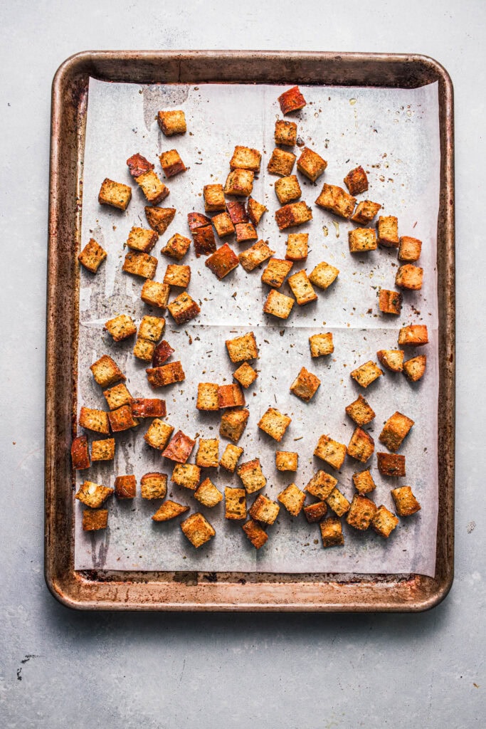 Croutons on baking sheet. 