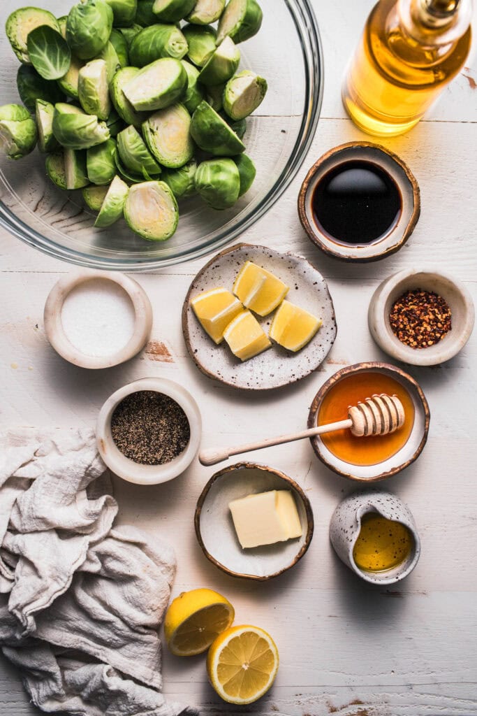 Ingredients for honey balsamic brussel sprouts on counter. 