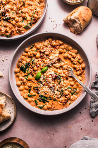 Two bowls of marry me beans on counter.