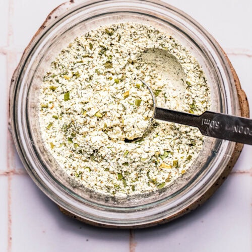 Spoon swirled into bowl of homemade ranch seasoning.