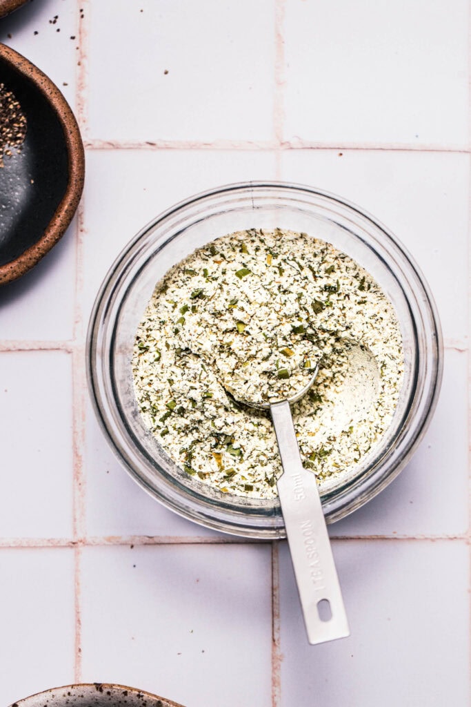 Ranch spice blend in bowl with spoon.