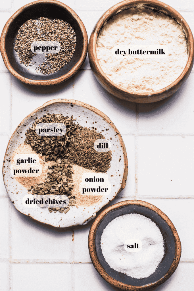 Ingredients for homemade ranch seasoning mix labeled on counter.