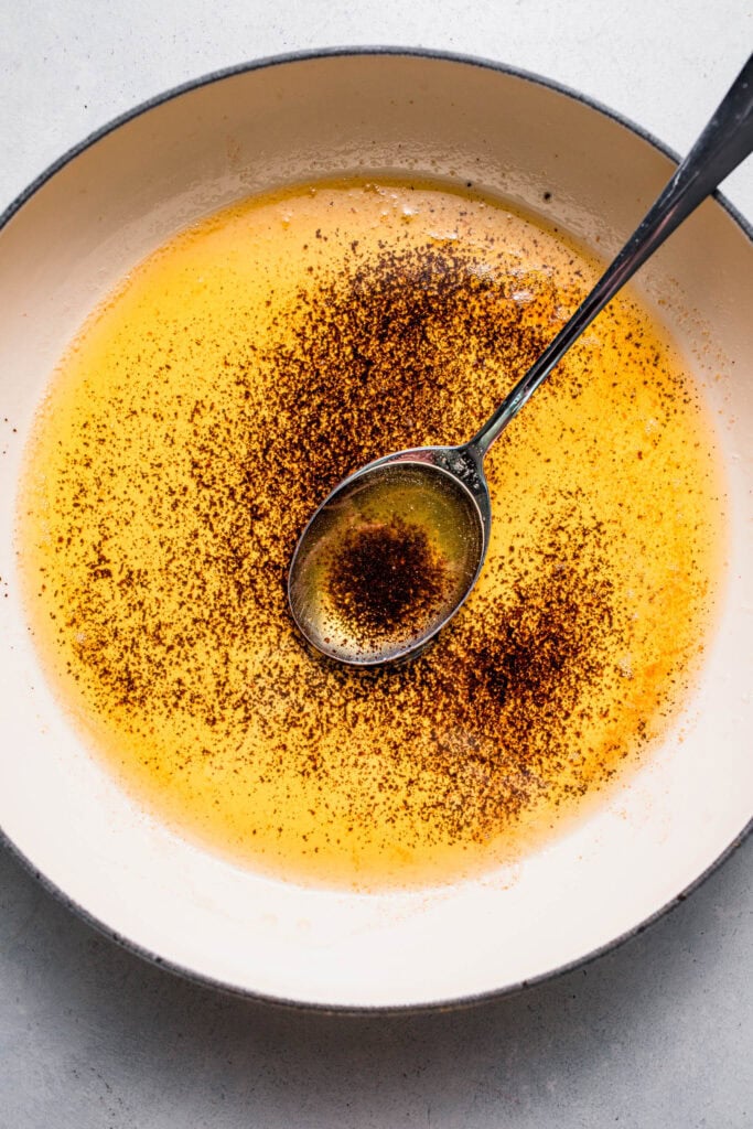 Overcooked browned butter in skillet. 