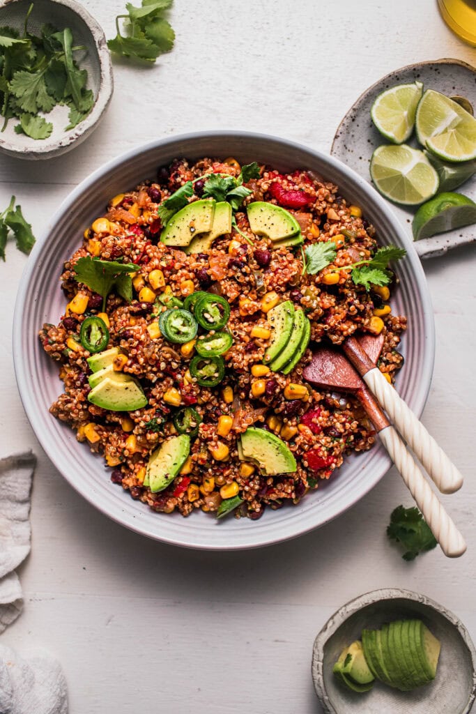 Overhead shot of mexican quinoa in white serving bowl.