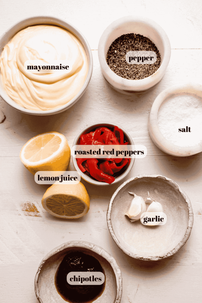 Ingredients for red pepper aioli labeled on counter. 
