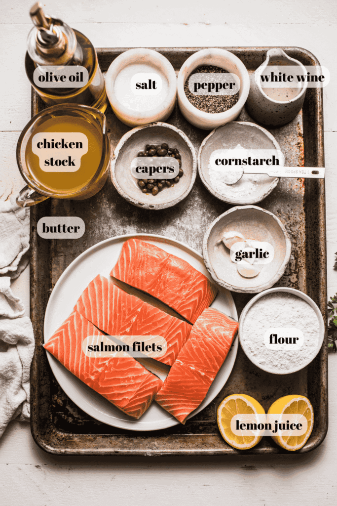 Ingredients for salmon piccata labeled on counter.
