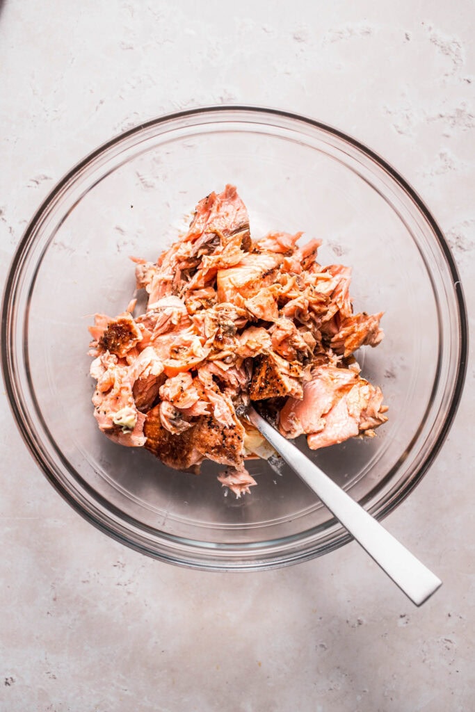 Salmon being combined with mayo, etc.