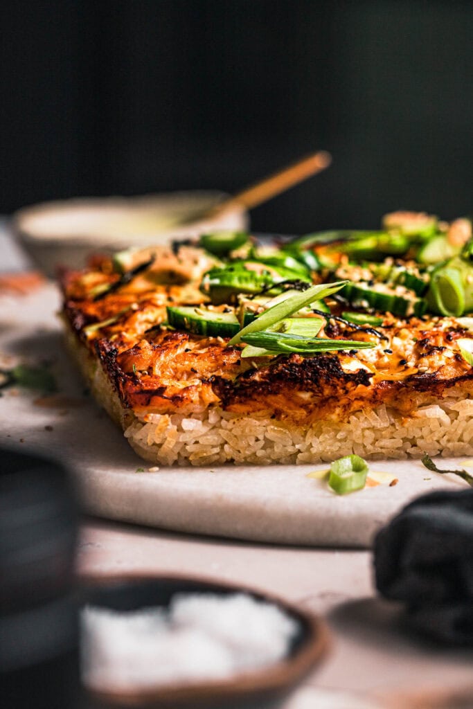 Side view of finished sushi bake showing crispy rice edges.