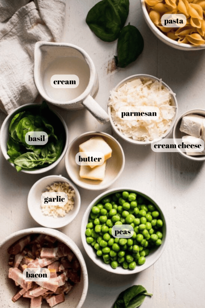 Ingredients for bacon pea pasta labeled on counter.