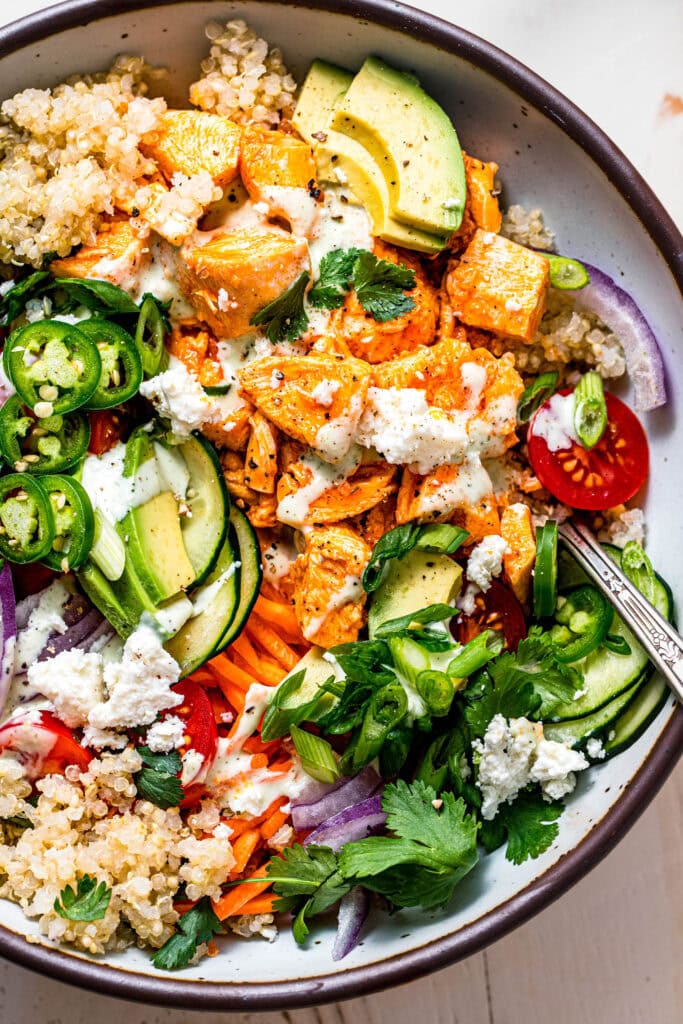 Overhead close up of buffalo chicken quinoa bowl.