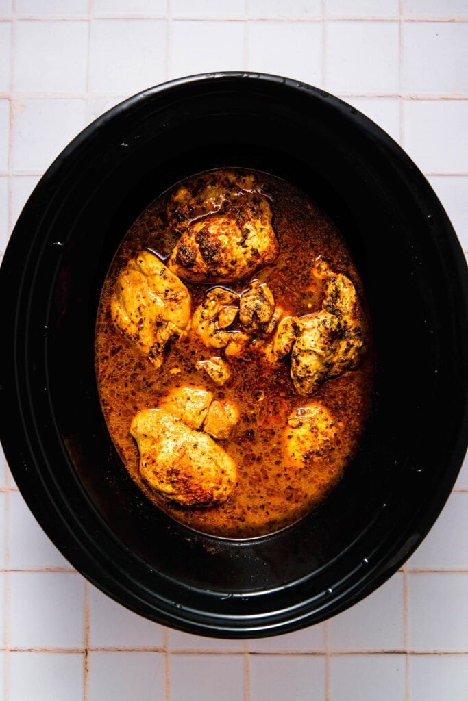Finished cooked chicken carnitas in slow cooker.