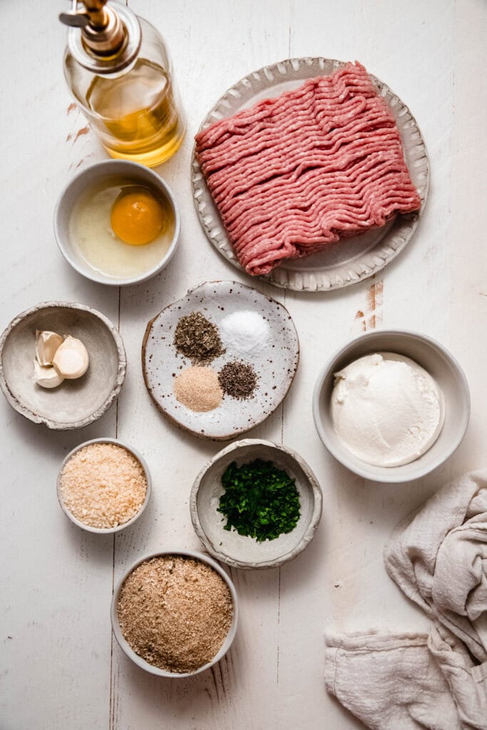 Ingredients for chicken ricotta meatballs on counter.