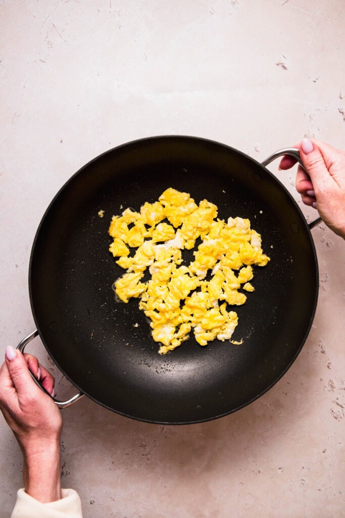 Egg frying in wok.