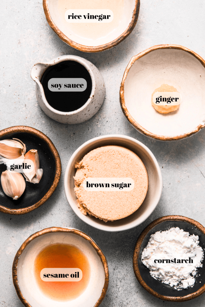 Ingredients for teriyaki sauce labeled on counter.