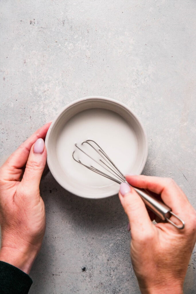 Cornstarch slurry being whisked together.