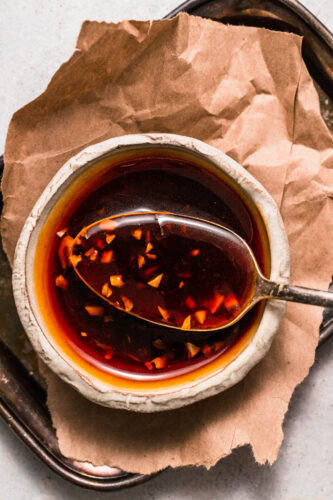 Overhead close up of spoonful of teriyaki sauce.