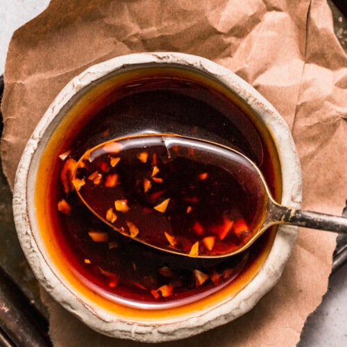 Overhead close up of spoonful of teriyaki sauce.