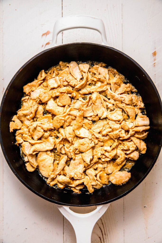 Cooked chicken in skillet.