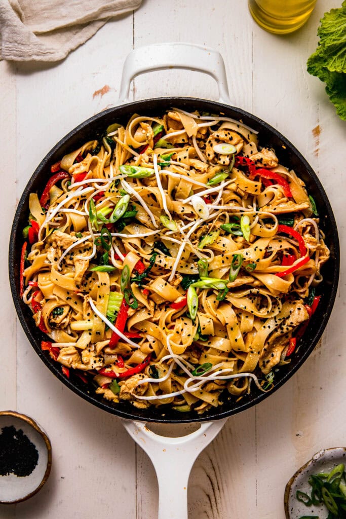 Finished chicken chow fun in skillet.
