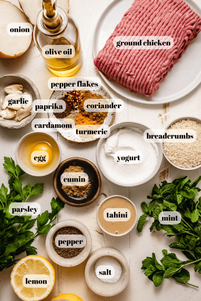 Ingredients for chicken shawarma meatballs labeled on counter.