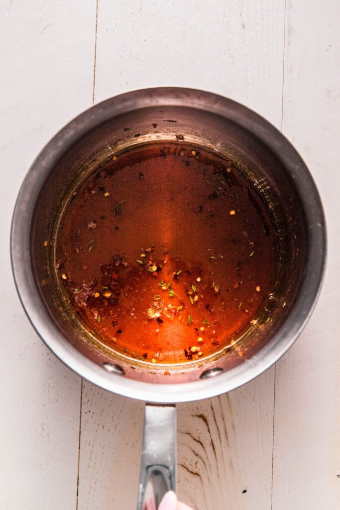 Hot honey mixture in sauce pot.