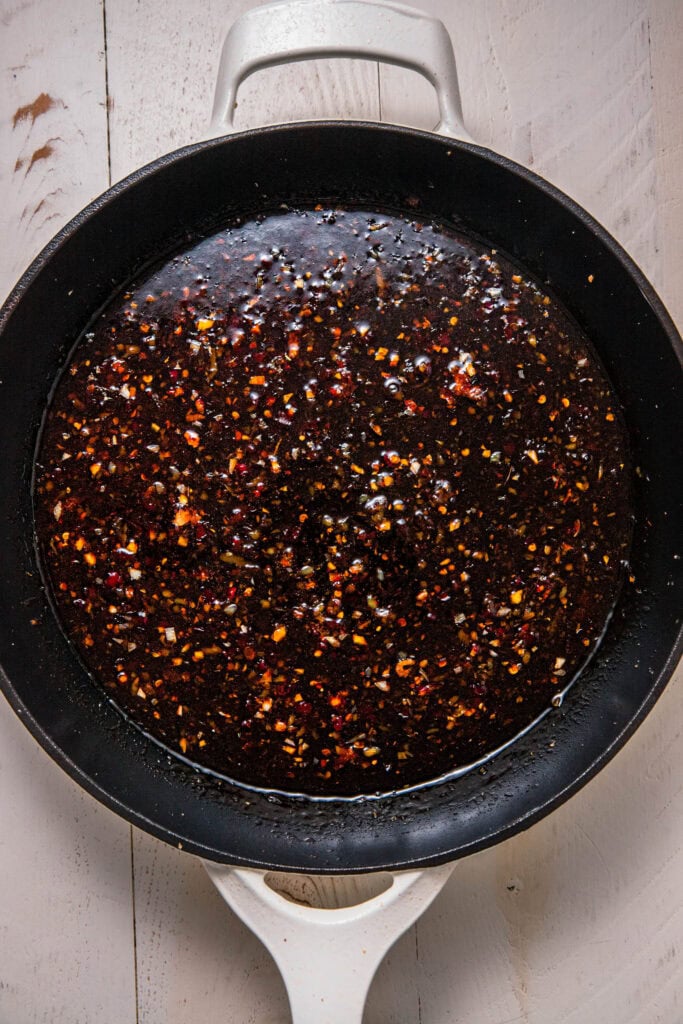 Sweet chili sauce ingredients in skillet.