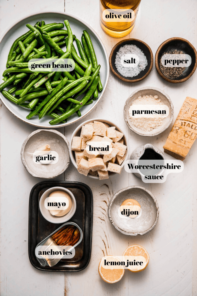 Ingredients for caesar green beans labeled on counter.