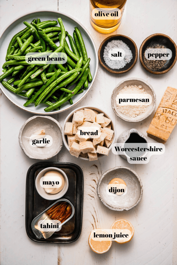 Ingredients for caesar green beans labeled on counter.