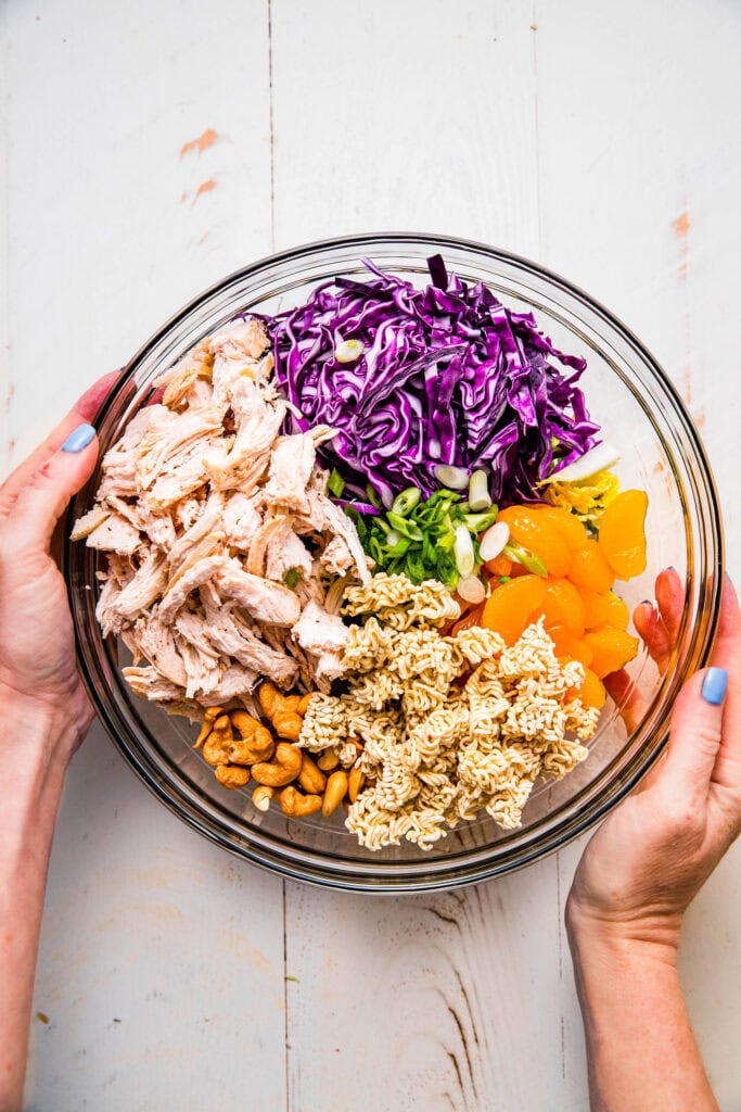 Chinese chicken salad ingredients in bowl before mixing.
