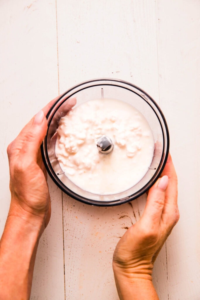 Cottage cheese, milk and lemon juice in food processor bowl.