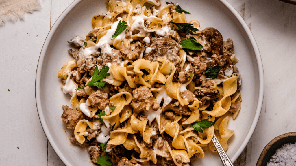 Horizontal image of ground turkey stroganoff in serving bowl.