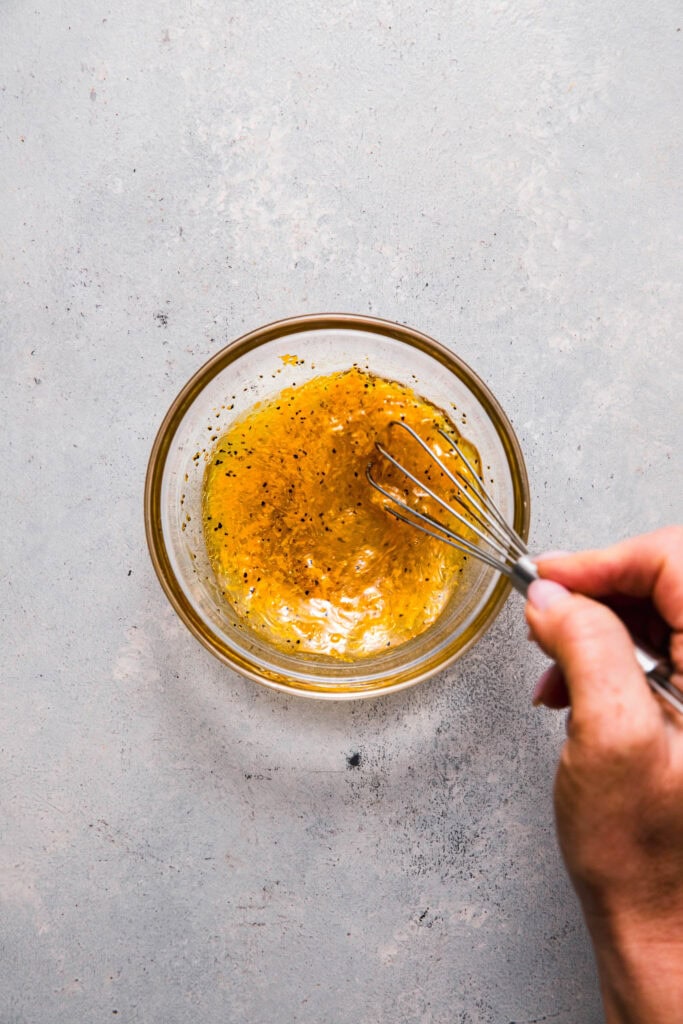 Dressing for mango slaw being whisked together.