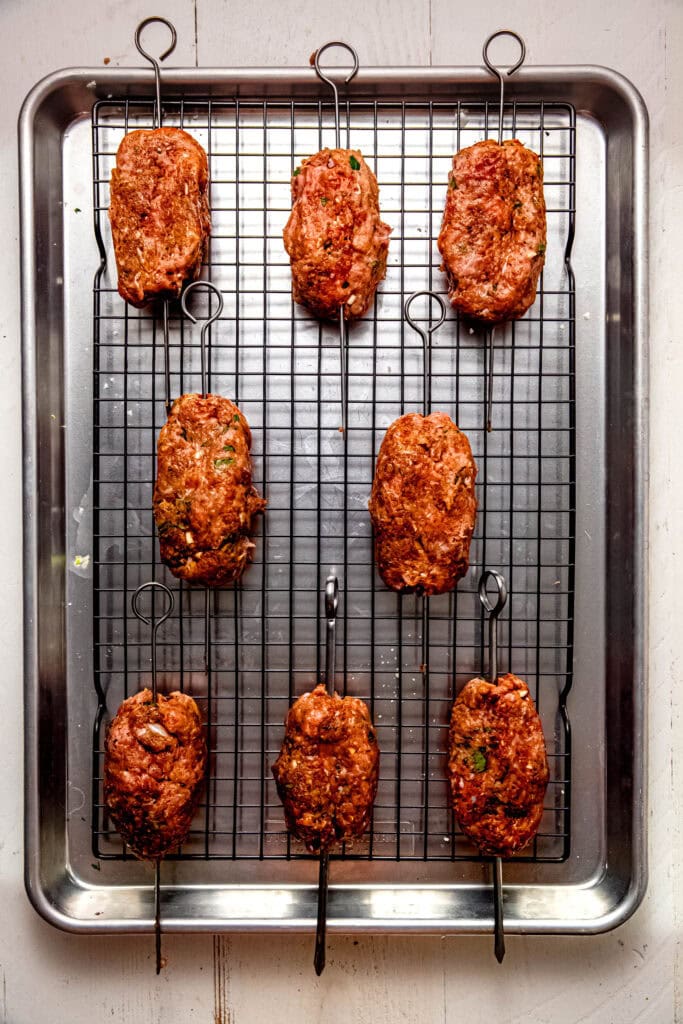 Formed kofta on baking sheet. 