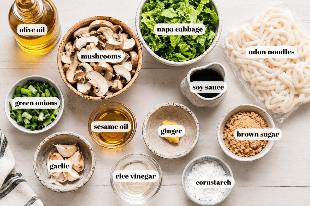 Ingredients for teriyaki noodles labeled on counter. 