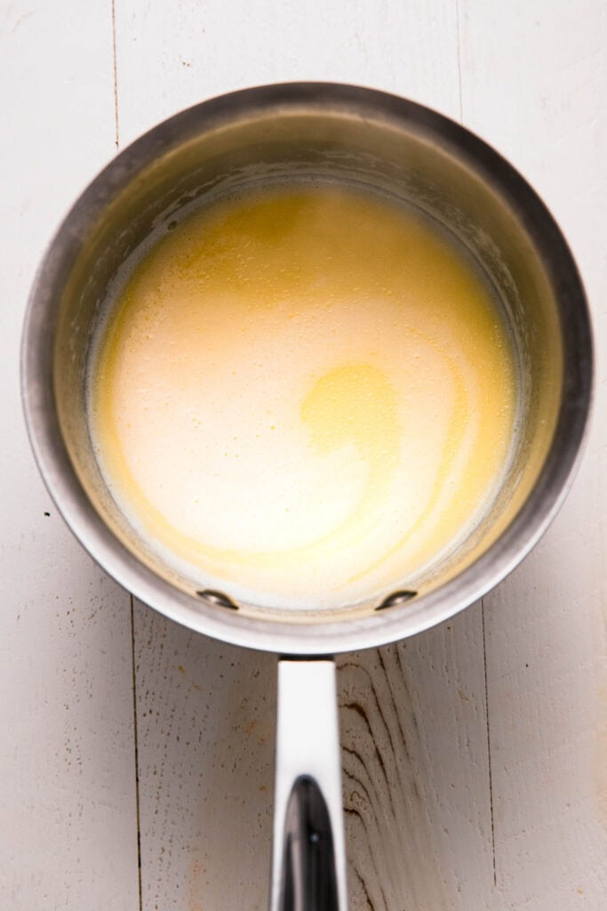 Warm butter and milk in pot.