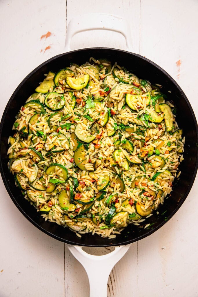 Finished zucchini orzo in skillet.